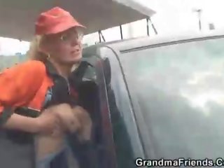 Blonde granny has threesome outdoors